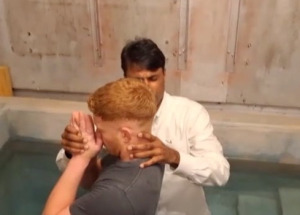 pastor-shibu-baptising.jpg